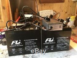 A pair of 12v75ah/10hr rechargeable leisure batteries With Charger